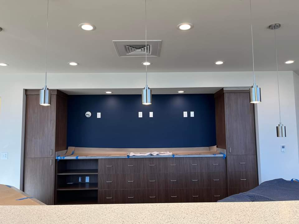 Commercial tenant build-out — recessed lighting, switching, and finish trim